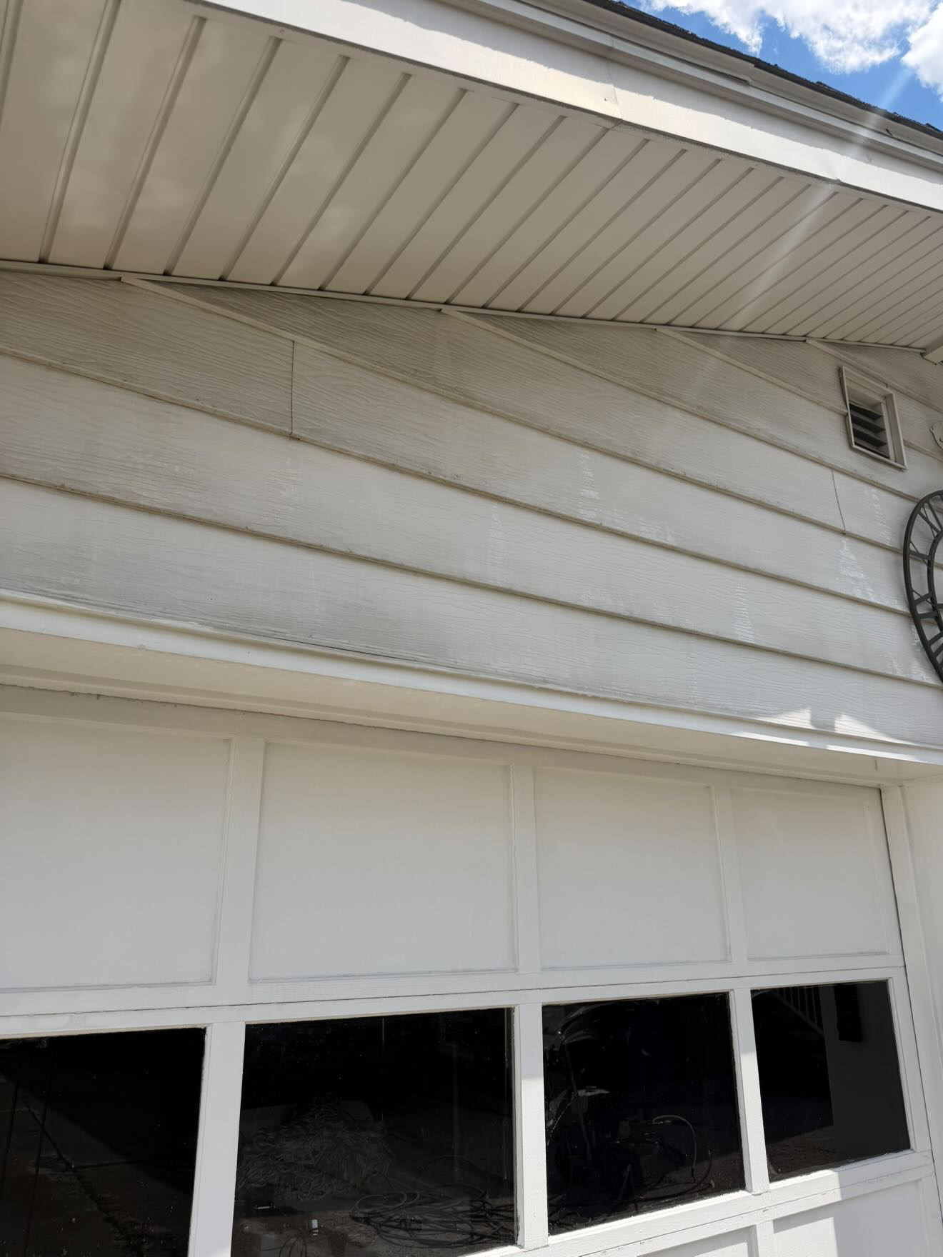 Clean house siding after soft washing