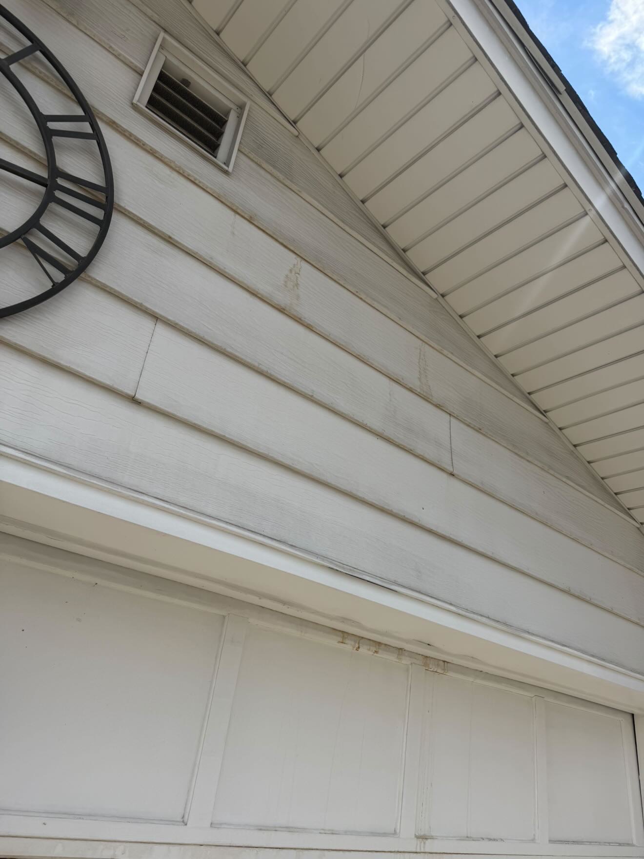 Dirty house siding with mold before cleaning